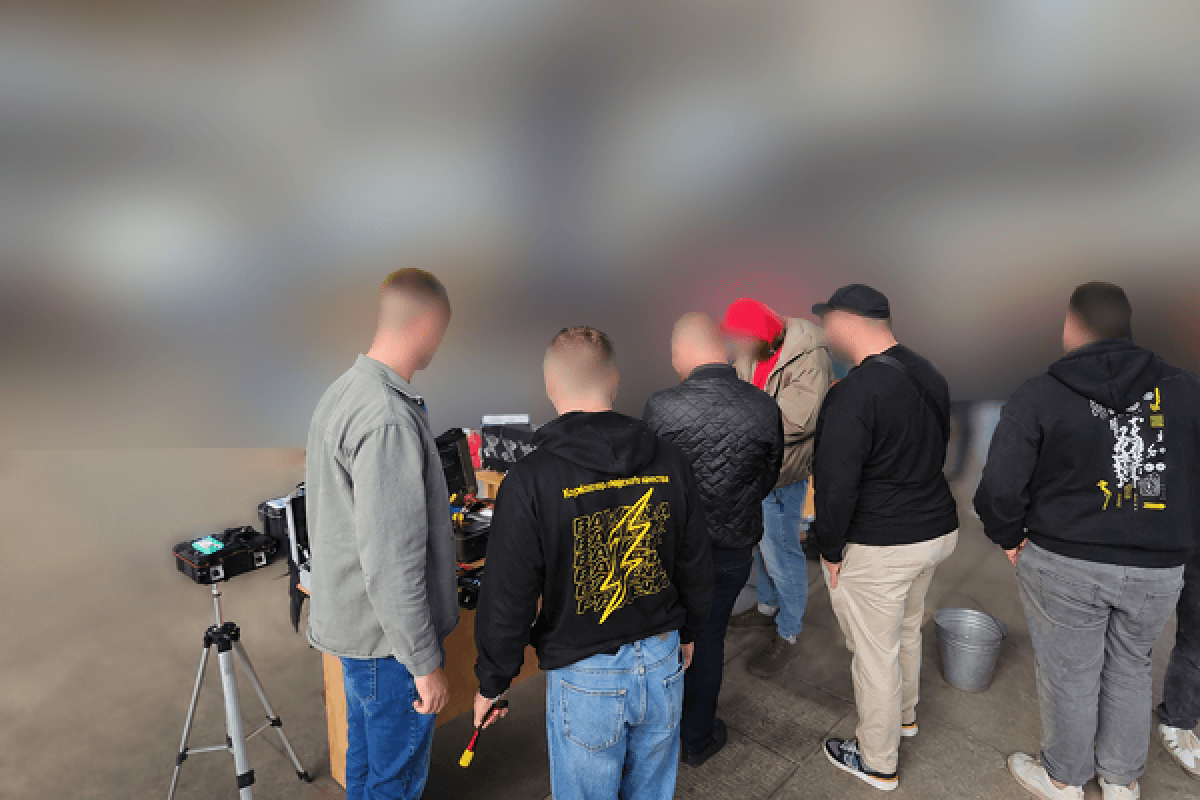 People testing equipment outdoors